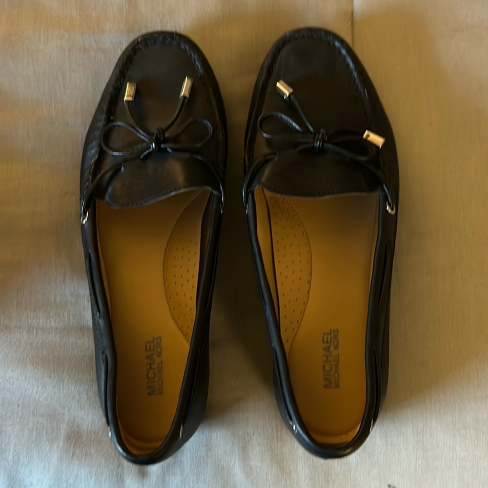 Michael Kors 
Flats hardy worn like new